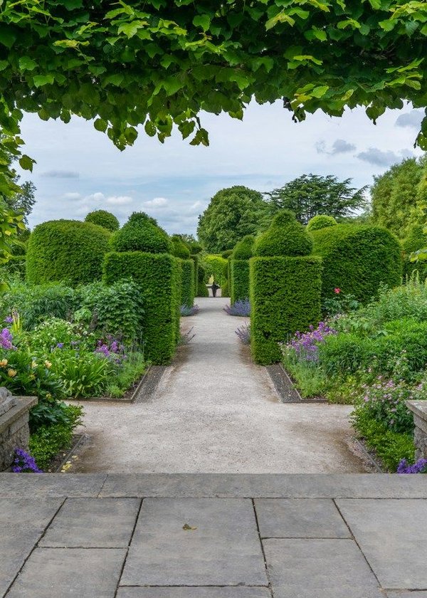 What are the challenges and opportunities in integrating vertical gardens into urban real estate developments?